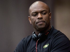 Former Edmonton general manager Ed Hervey stands on the sidelines before a Canadian Football League game against the B.C. Lions in Vancouver in this file photo from June 28, 2014.