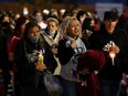 Angela Chalifoux (centre), mother of Sierra Chalifoux-Thompson, is surrounded by family and supporters during a candlelight vigil and march to remember her daughter in Edmonton, on Thursday, Oct. 8, 2020.