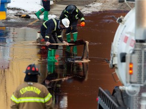 Crews cleanup a chemical spill at the Hexion facility near 156 Street north of Yellowhead Trail in Edmonton, on Saturday, Dec. 5, 2020. Edmonton Fire Rescue Services were called to the scene in the morning.