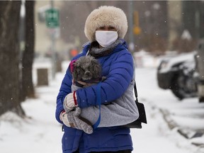 Annaka Cook, a volunteer with ElderDog walks Bella who is owned by a senior that needs help walking their dog. Taken on Thursday, Dec. 17, 2020 in Edmonton.  ElderDog provides a range of assistance and supports, including:   Assistance with obtaining food and feeding, assistance with animal hygiene, Minor grooming such as nail clipping or help with brushing, transportation to and from vet or groomer and temporary care during hospitalization.