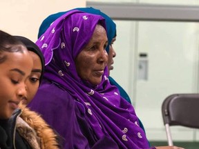 Muraado Raage (in a purple hijab), a founding member of the Hoyo Collective, sits with the younger generation at a meeting before the pandemic. Photo credit: Dunia Nur