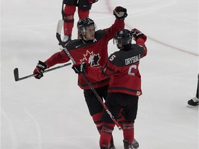 Canada's Jamie Drysdale (6) celebrates his goal against Russia with teammate Bowen Byram (4) during third period IIHF World Junior Hockey Championship pre-competition action on Wednesday, Dec. 23, 2020 in Edmonton.