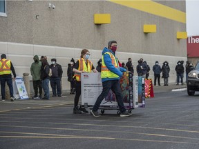 Boxing Day Shoppers looking for deals lined up outside Best Buy in South Edmonton Common despite the Coronavirus pandemic December 26, 2020. Photo by Shaughn Butts / Postmedia