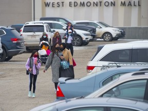 Boxing Day Shoppers looking for deals lined up outside Best Buy in South Edmonton Common, Saturday, Dec. 26, 2020.