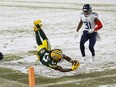 Green Bay Packers running back Aaron Jones (33) rushes with the football during the first quarter against the Tennessee Titans at Lambeau Field.