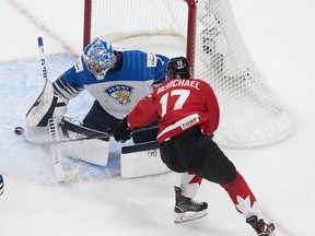 Canada's Connor McMichael (17) is unable to get the puck past Finland's goalie Kari Piiroinen (1) during first period IIHF World Junior Hockey Championship action on Thursday, Dec. 31, 2020 in Edmonton.