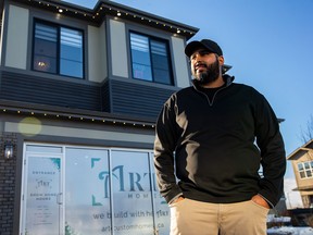 Art Custom Homes President and owner, Arman Pandher, stand's outside the builder's showhome in Arbours of Keswick.