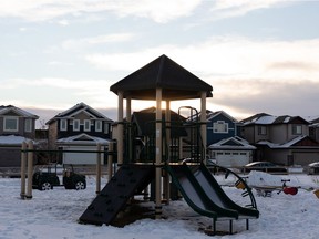 The newly opened Verte-Homesteader Park's play area is seen in Edmonton, on Saturday, Dec. 5, 2020. The playground is on the former Domtar site and the City of Edmonton opened the park after public health orders confirmed it's safe from contaminants. Some fenced areas remain in the corners of the park.