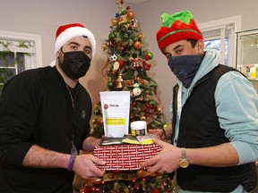 Brothers Ahmed and Ahsen with some of the popular items at Mt. Kushmore Cannabis Dispensary during the Christmas season in Calgary on Tuesday, Dec. 22, 2020.