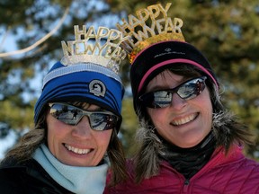 Natalie Parks (left) and Carol Holod (right) celebrated the first day of the new year at the 33rd Annual Edmonton Resolution Run held at the William Lutsky YMCA in Edmonton on January 1, 2018.
