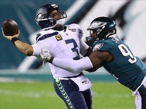 Javon Hargrave of the Philadelphia Eagles pressures Russell Wilson of the Seattle Seahawks during the second quarter at Lincoln Financial Field on November 30, 2020 in Philadelphia.