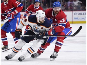 Montreal Canadiens defenceman Jeff Petry (26) checks Edmonton Oilers forward Leon Draisaitl (29) during the first period at the Bell Centre on Thursday, Jan. 9, 2020.