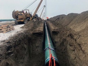 Pipe is laid for the Trans Mountain pipeline expansion project near Edmonton in late December 2019.