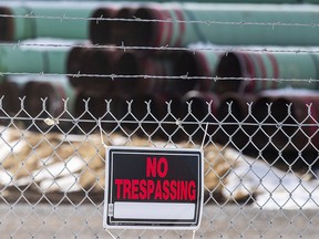 In this Dec. 18, 2020 photo, pipes to be used for the Keystone XL pipeline are stored in a field near Dorchester, Neb.