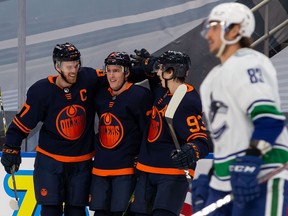 Tyson Barrie (centre) and pals celebrate yet another powerplay goal by the Edmonton Oilers.