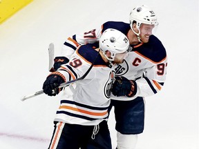 Leon Draisaitl #29 of the Edmonton Oilers is congratulated by his teammate Connor McDavid #97 after scoring his second goal of the game against the Chicago Blackhawks during the second period in Game 3 of the Western Conference Qualification Round at Rogers Place on August 05, 2020.