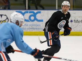 Edmonton Oilers defenceman Evan Bouchard runs a drill during Edmonton Oilers training Camp at NAIT on Tuesday, Jan. 5, 2021.