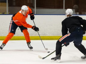 Edmonton Oilers Jesse Puljujarvi (98) and Darnell Nurse (25) run a drill at Oilers Training Camp at NAIT in Edmonton, on Tuesday, Jan. 5, 2021.