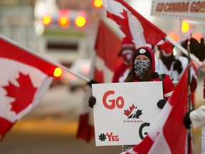 Team Canada fans cheer on the team outside Rogers Place prior to the start of the gold-medal game against Team USA at the IIHF world junior championship in Edmonton on Tuesday, Jan. 5, 2021.