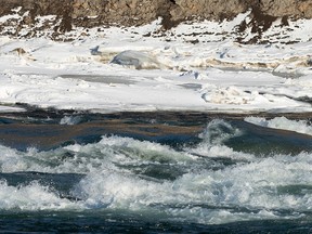 Water runs over ice making rapids in the North Saskatchewan River in Edmonton, on Thursday, Jan. 14, 202. Edmonton Fire Rescue Services are reminding Edmontonians to stay off the river as they have responded to seven river rescue calls in the last two weeks, an almost 50 per cent increase in call volume year-over-year. Photo by Ian Kucerak