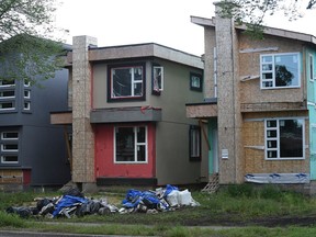Construction debris sits in front of several infill houses in 2016. Residents in mature neighbourhoods say they want to see more enforcement from the city around damage caused by infill construction.