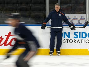 Edmonton Oilers head coach Dave Tippett watches his players during a practice on the ice at Rogers Place on Feb. 7, 2020.