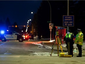 Edmonton Police Service officers investigate a fatal collision involving a crane truck and a bicycle at 94B Avenue and 50 Street in Edmonton, on Monday, Jan. 4, 2021. Photo by Ian Kucerak