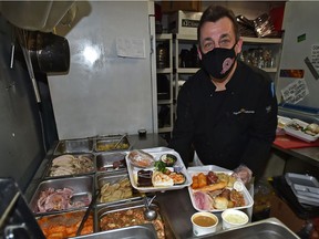 Borderline Pub & Grill owner Wally Zack is incredibly busy with Ukrainian Christmas meals take-out as customers pickup their traditional meals in Edmonton, January 6, 2021. Ed Kaiser/Postmedia