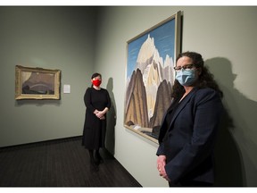 Sian Barraclough, right, of Capital Power and Catherine Crowston stand with pieces from the Group of Seven exhibit at the Art Gallery of Alberta. Capital Power funded a virtual tour of a Group of Seven show that started in September and runs through March.