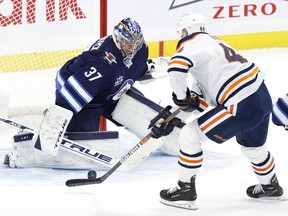 Edmonton Oilers right wing Zack Kassian (44) get set to shoot on Winnipeg Jets goaltender Connor Hellebuyck (37) in the second period at Bell MTS Place on Jan. 26, 2021.