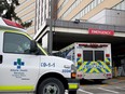 An ambulance is seen parked in the emergency entrance of the Foothills Medical Centre in Calgary on Dec. 9, 2020.