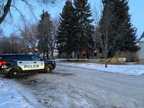 An Edmonton police cruiser rests out front of taped-off home near 78 Avenue and 111 Street in southwest Edmonton on Thursday, Jan. 7, 2021.