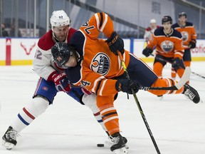 Edmonton Oilers defenceman Ethan Bear (74) and Montreal Canadiens' Jonathan Drouin (92) battle for the puck Saturday, Jan. 16, 2021, in Edmonton.