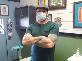 Will Woods, co-owner of Peppermint Hippo Tattoo in Lethbridge, AB poses in a recent submitted image. He has reopened the shop despite provincial COVID-19 regulations on Monday, Jan. 11, 2021.