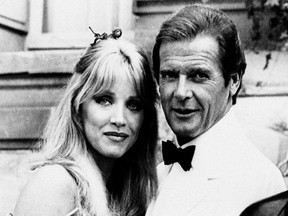 Actor Roger Moore and co-star Tanya Roberts in front of the Chateau de Chantilly near Paris, France, on the set of the Bond film A View to a Kill on Aug. 17, 1984.