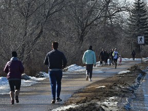 Along River Valley Rd. people hit the trails and also the parks, in Edmonton, on March 21, 2020. File photo