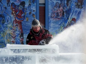 Ice carver Kelly Davies works on a sculpture in preparation for the Deep Freeze festival (Feb 5 - 14) at the Alberta Avenue Community League, 9210 118 Ave., in Edmonton Thursday Jan. 28, 2021.