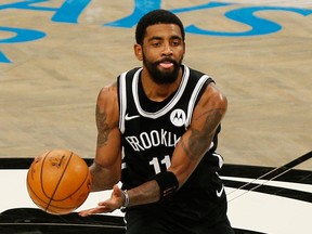 Brooklyn Nets guard Kyrie Irving dribbles the ball against the Utah Jazz during NBA action on Jan. 5, 2021, at Barclays Center.