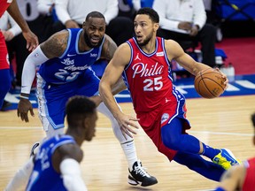 Philadelphia 76ers guard Ben Simmons, right, drives against Los Angeles Lakers forward LeBron James during NBA action on Jan. 27, 2021, at the Wells Fargo Center.