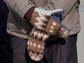 Senator Bernie Sanders wears mittens as he attends the inauguration of Joe Biden as the 46th President of the United States on the West Front of the U.S. Capitol in Washington, U.S., January 20, 2021.