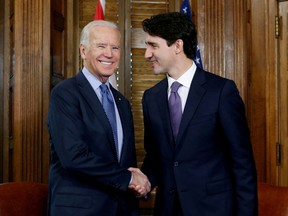 FILE PHOTO: Canada's Prime Minister Justin Trudeau (R) shakes hands with U.S. Vice President Joe Biden during a meeting in Trudeau's office on Parliament Hill in Ottawa, Ontario, Canada, December 9, 2016.