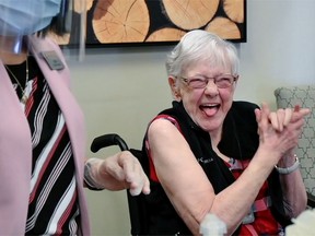 Helen Rhyno, 83 yrs old reacts after receiving a shot of Moderna vaccine at Mayfair Care Centre on December 30, 2020. She was one of the first Albertans to receive a COVID-19 vaccine.