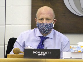 Mayor Don Scott wears a mask during a council meeting on Oct. 13, 2020.