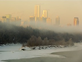 The downtown skyline is partially obscured by fog rising from the North Saskatchewan River on Friday, Jan. 29, 2021 in Edmonton.