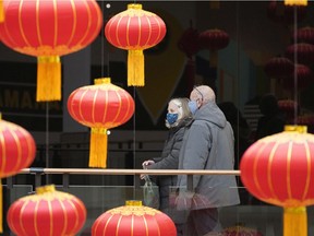 Shoppers walk past a Lunar New Year lantern display at Kingsway Mall in Edmonton on Friday, Feb. 5, 2021. The mall held a virtual online New Year celebration on Saturday and Sunday.