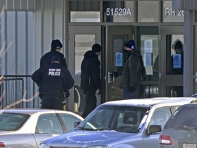 Police enter GraceLife Church in Parkland County, just east of Edmonton on Sunday Feb. 7, 2021.