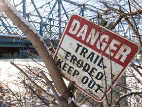 A closed trail sign is seen on the side of Riverside Trail along Riverside Golf Course near the North Saskatchewan River in Edmonton on Monday, Feb. 8, 2021.