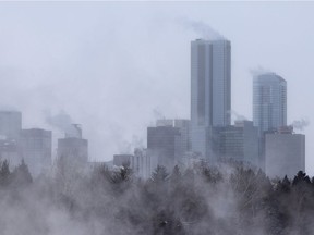 Downtown is seen as steam rises off a freezing North Saskatchewan River as the air temperature hits -25 degrees Celsius in Edmonton, on Wednesday, Feb. 10, 2021.