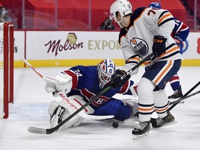 Montreal Canadiens goalie Jake Allen (34) stops Edmonton Oilers defenceman Evan Bouchard (75) during the first period at the Bell Centre on Feb. 11, 2021.