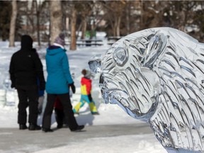 An ice sculpture of a beaver looks over as visitors take in the Deep Freeze: A Byzantine Winter Fête at Borden Park on Valentine's Day in Edmonton, on Sunday, Feb. 14, 2021.